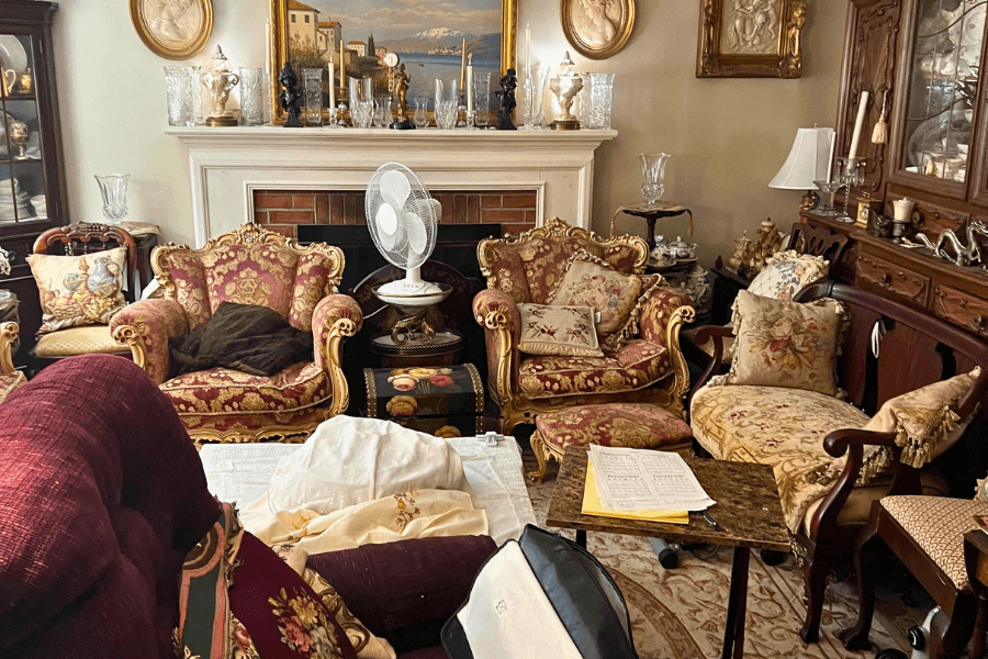 a living room full of furniture during an estate cleanout